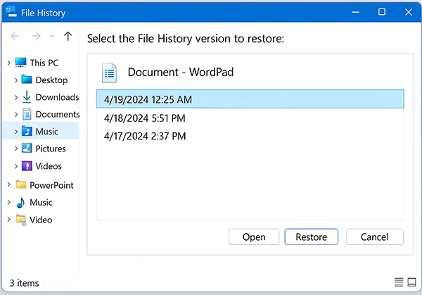 Windows File History panel displaying previous file versions for recovery
