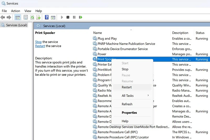 Windows Services console with Print Spooler service being restarted