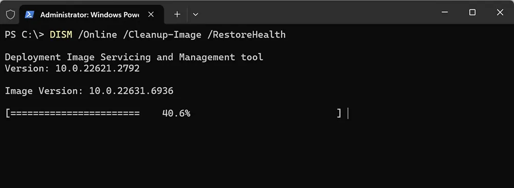 PowerShell terminal running DISM RestoreHealth command to repair Windows 11 component store